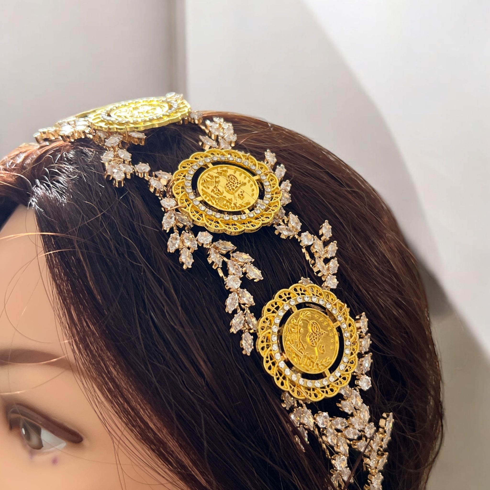 Kh. Bayt Ta'mir five coins headpiece