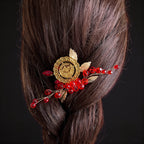 Makr Red Gold one coin comb hair accessories featuring red and gold details in a stylish updo.