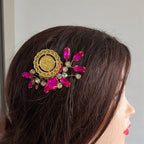 Makr Pink and Gold coin comb hair accessories on a hairstyle, showcasing elegant design and vibrant colors.