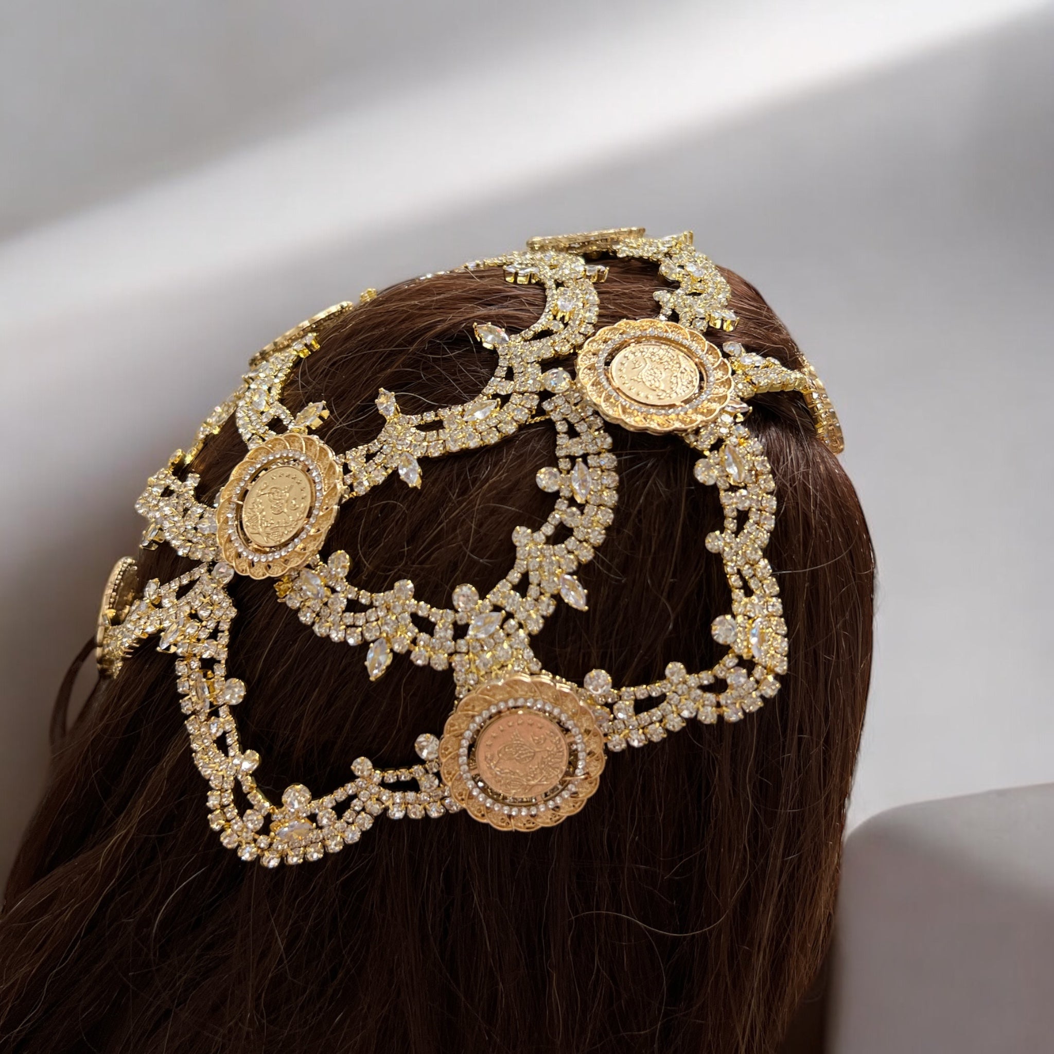 Raba eight coins head piece