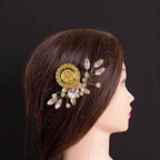 Makr light Pink and Gold coin comb hair accessories on a mannequin's hair for elegant styling.