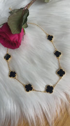 Iqrit Black and pleated Gold necklace